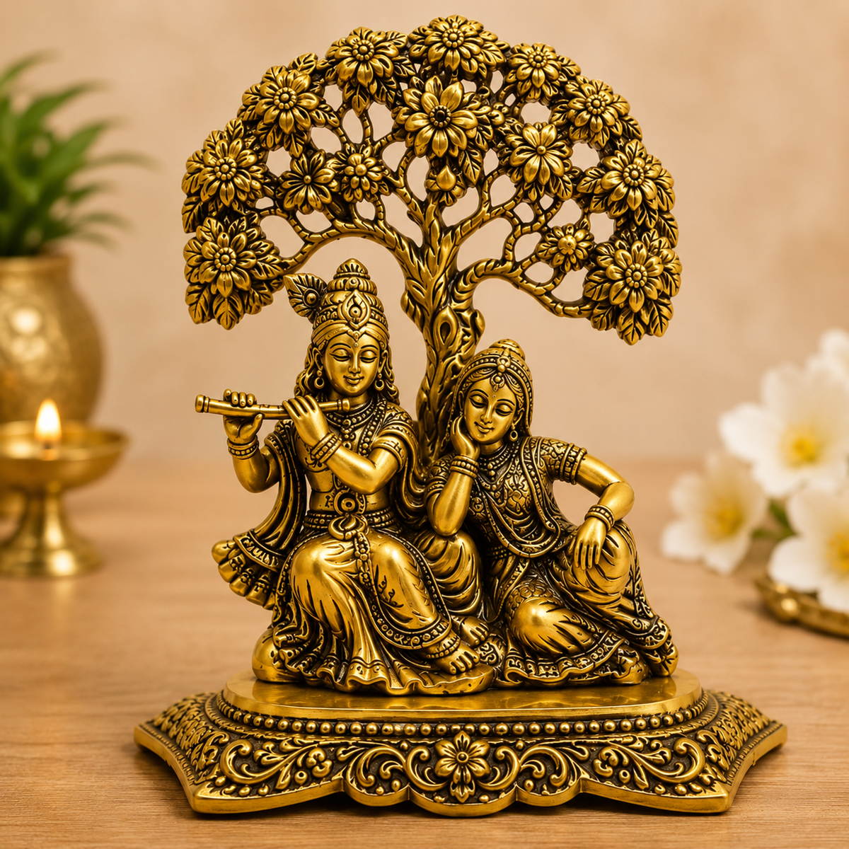 Golden Radha Krishna Idol Under Floral Tree
